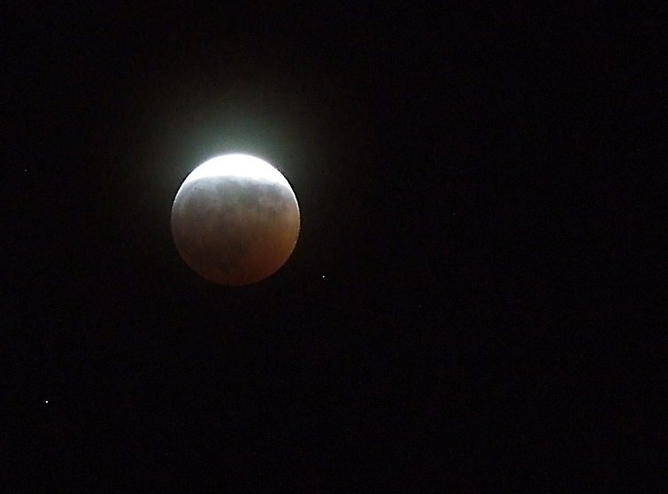 Image of a partial lunar eclipse courtesy of Flickr's "seeks2dream" and 