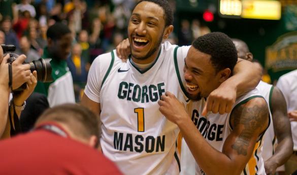 After his long-range buzzer-beater, Sherrod Wright (right) and his teammates were all smiles. The miraculous shot gave the Patriots the 62-61 victory Tuesday night (John Powell).