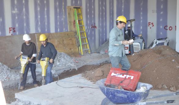 Construction workers begin turning the empty space into a full-menu Panda Express. (Jake McLernon)