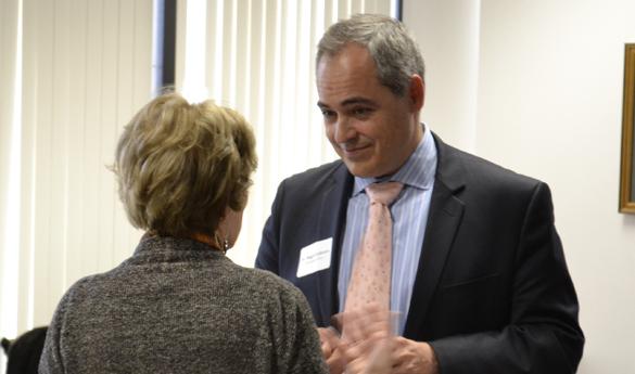 Incoming president Ángel Cabrera speaks to Faculty Senate member Susan Trencher at a Wednesday meet-and-greet. (Kevin Loker)