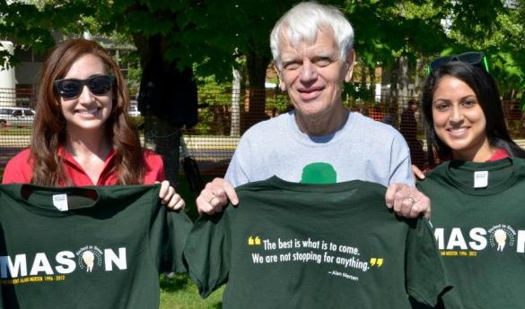 "Etched in Stone" managing editor Erin Powell poses with President Alan Merten and Editor-in-Chief Monika Joshi at Mason Day on April 27 (Jake McLernon). 