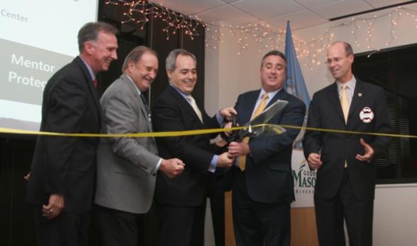  President Cabrera (third from left) joins Fairfax Mayor Silverthorne (fourth from left). The Mayor is holding the scissors. (Photo courtesy of MediaForce PR) 