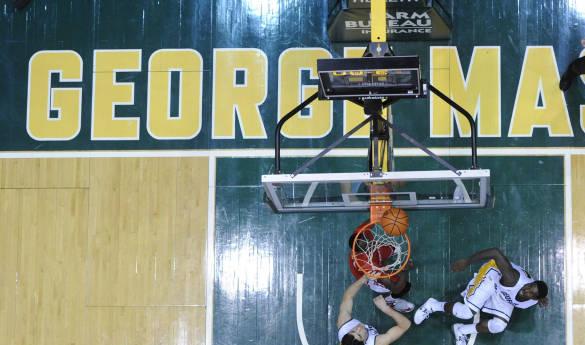Junior guard Bryon Allen's layup hangs on the rim before dropping for a Mason win. (Photo courtesy of Mason Athletics.)